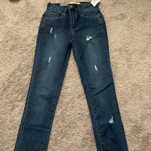 High rise Lightly ripped dark denim jeans